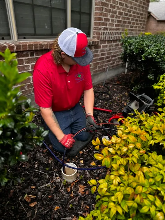 Hole in One Plumbing technician running test lines into an outdoor sewer cleanout